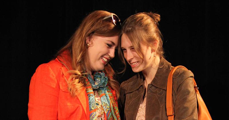 two female characters onstage