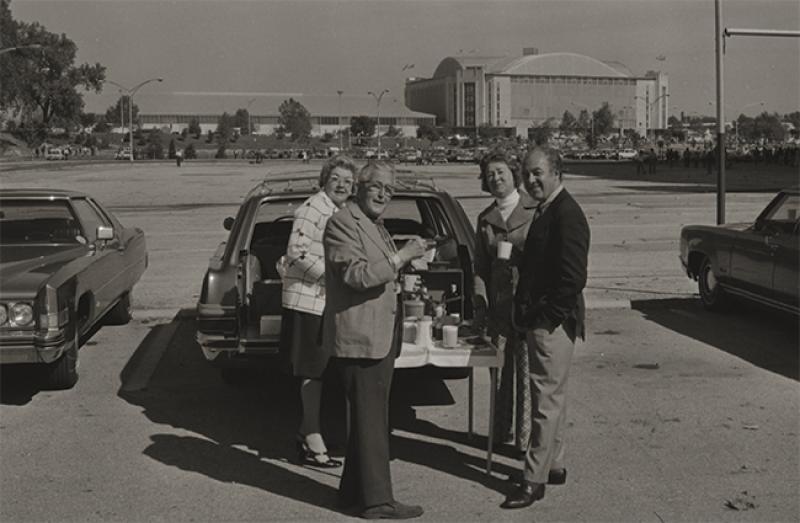 Fans tailgating at a football game in 1968.