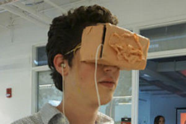 Samuel Kennard experiencing Riley Patrick’s work with Google Cardboard headset