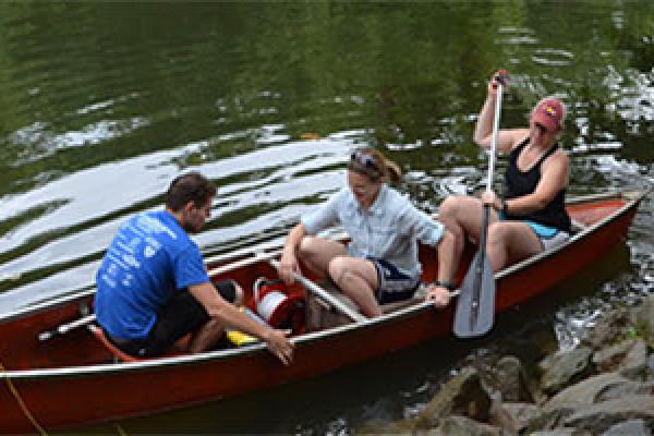 Corey Wallace; co-PI Rebecca Barnes; and Sawyer (middle), in a canoe during their first field season this past August.