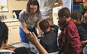 Volunteers from Ohio State in a classroom with students