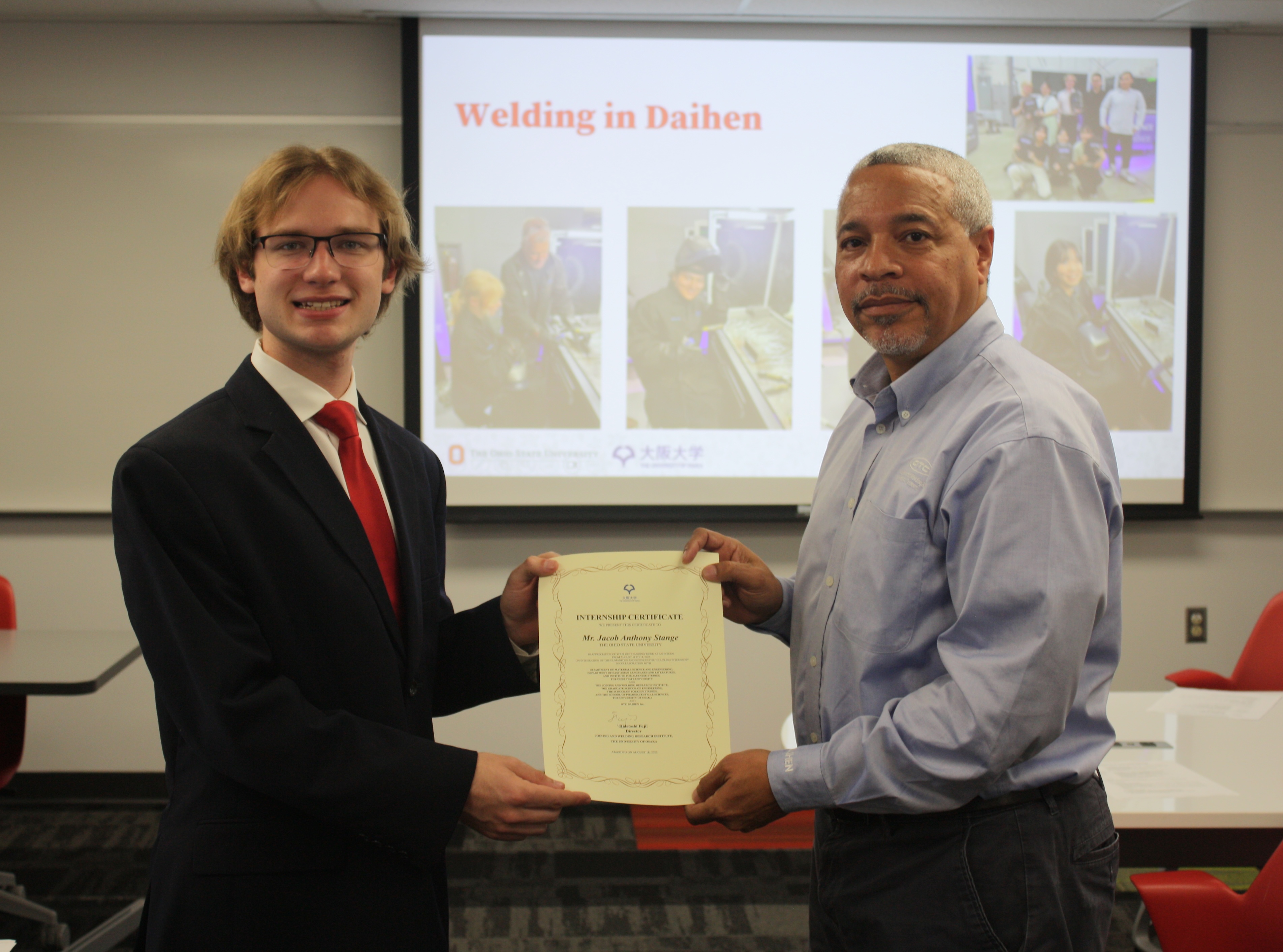 Ohio State student Jacob Stange receives a certificate for his internship