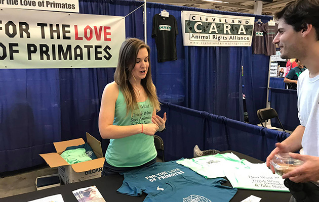 Tessa Cannon presenting information at a For the Love of Primates booth