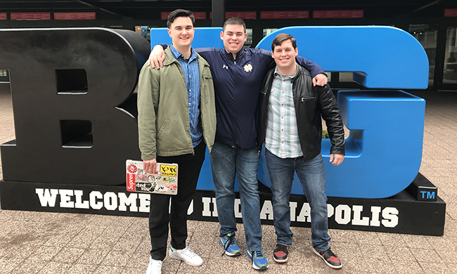 From left: Griffin Strom, Lantern sports director Brian Nelson and Lantern assistant sports editor Andy Anders in front of the Bankers Life Fieldhouse in Indianapolis