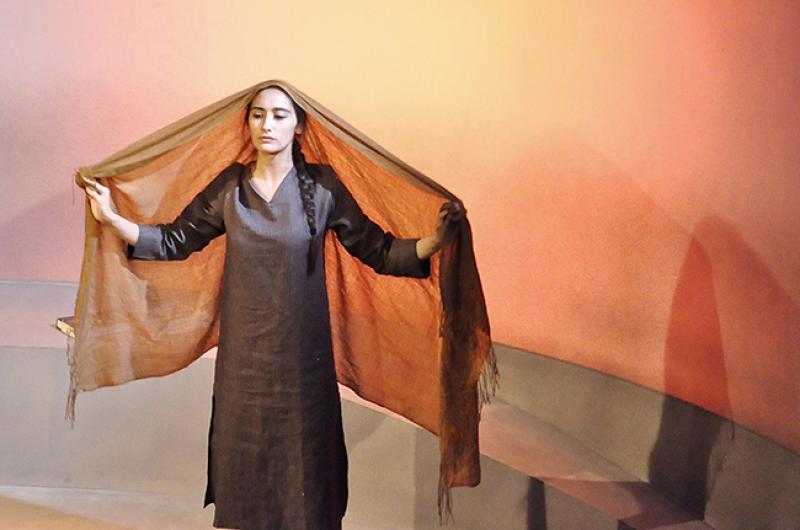 An actress performs in “Behind the Blast Wall” by Sonali Bhattacharyya, produced by Palindrome Productions, October 2017, London. Image by Manuela Chastelain.