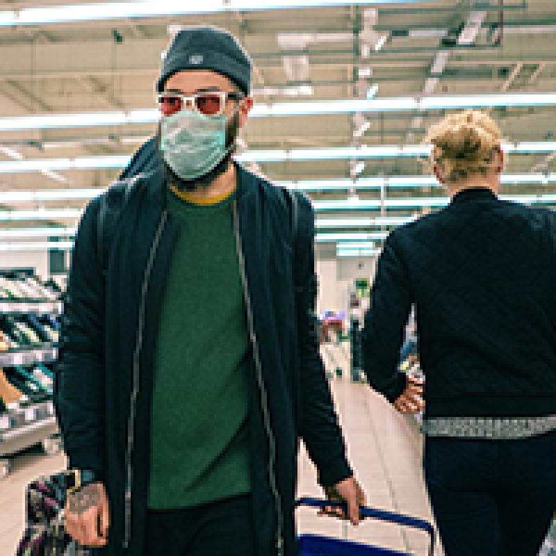 Man in grocery store wearing mask