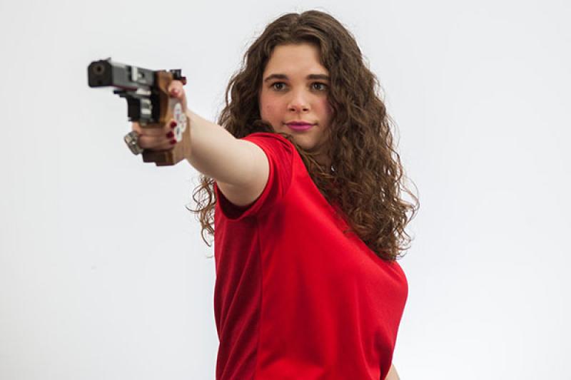 Emily Nothnagle pointing her pistol
