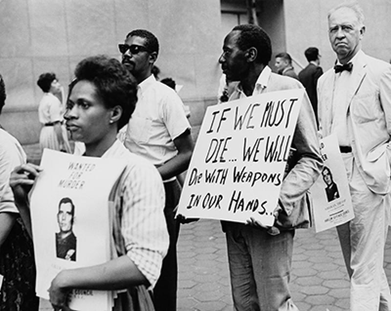 A protest outside the UN Headquarters in New York City, during a period of rioting sparked by the killing of African American teenager James Powell by off-duty police officer Thomas Gilligan, 23rd July 1964