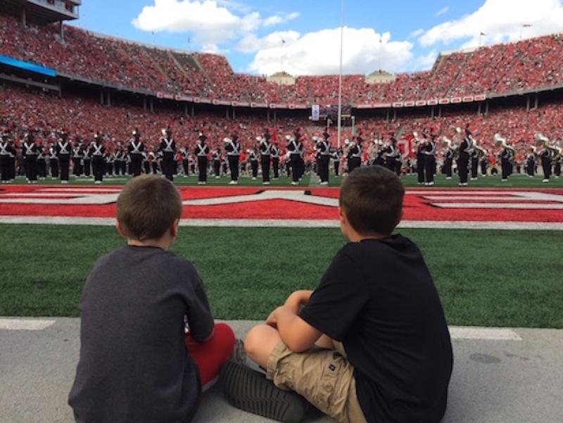 Two Special Spectators watch OSUMB perform during halftime