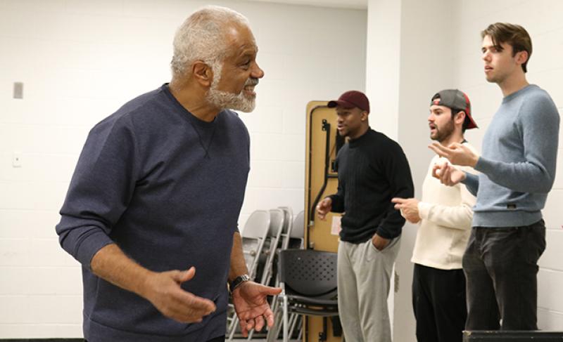 "Red Velvet" guest director Ted Lange leads the production's cast in warmups before rehearsal.