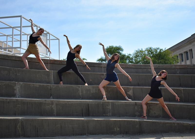 Ballet dancers posing on steps