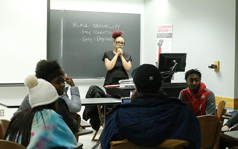 Lecturer Celia Peters, a filmmaker, observes students during an exercise in her class, "Black Visual Culture and Popular Media."
