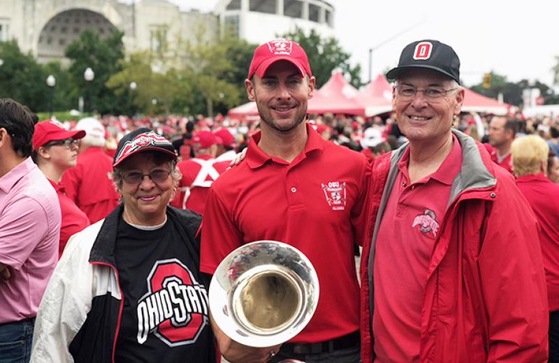 Rob Gast stands with his parents, Bob and Lynn Gast, before the Ohio State-Tulane football game on Sept. 22.