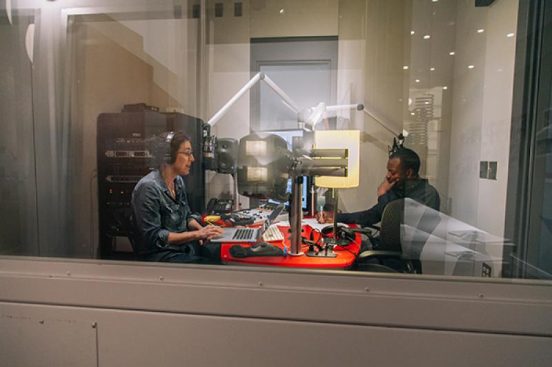 "Serial" host Sarah Koenig, left, in the recording room with co-host and reporter Emmanuel Dzotsi. Photo credit Sandy Honig.
