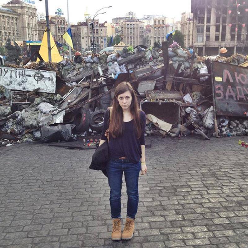 Sonya Bilocerkowycz stands in front of a barricade in Kyiv, Ukraine, in the aftermath of the Ukrainian revolution in spring 2014.