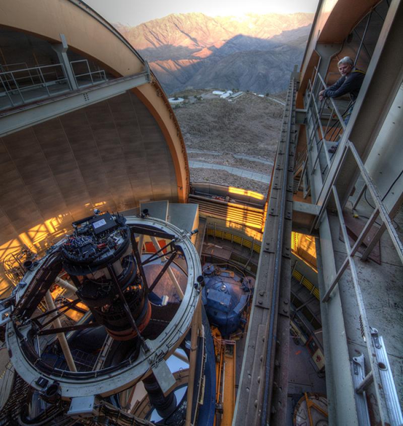 Physics Professor Klaus Honscheid in the dome of the telescope where the Dark Energy Camera is mounted (T. Abbott, CTIO)
