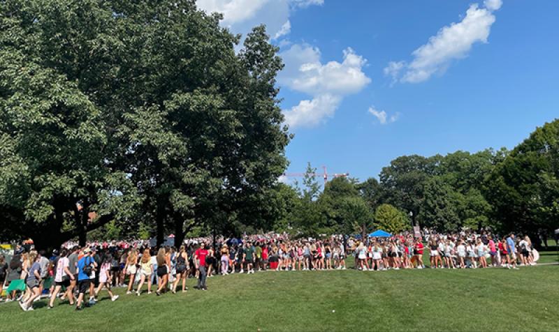 Student on the oval at the ohio state involvement fair