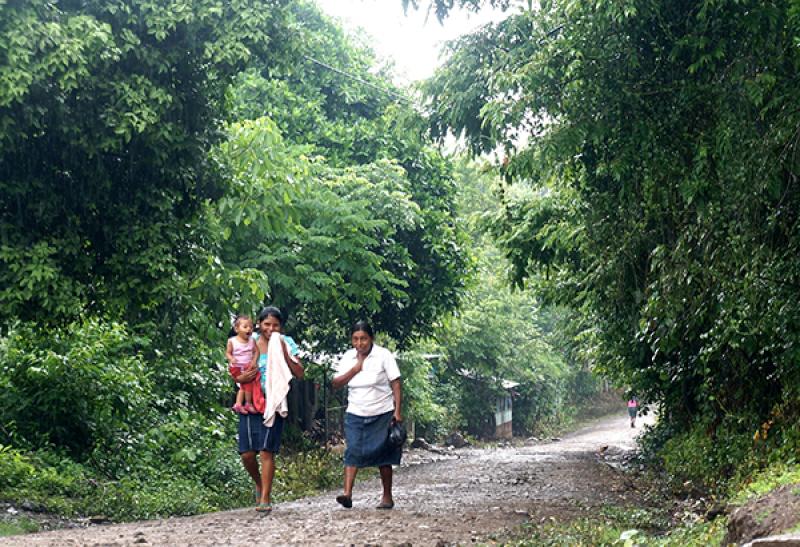 Rural Nicaraguan women walk down a path