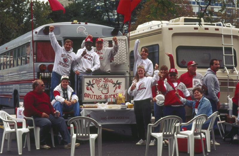 Fans tailgating at a football game in 1990.