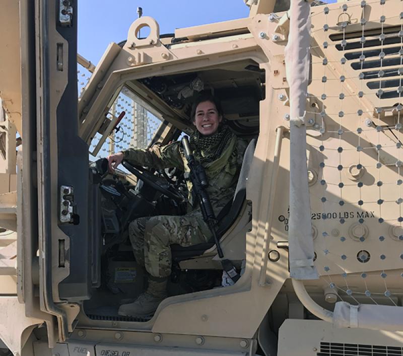 Sarah Wood in a military vehicle