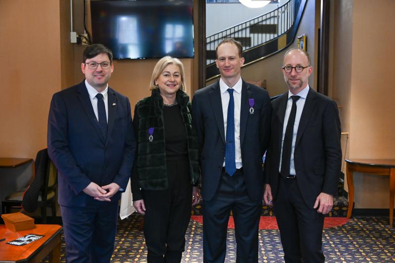 a group of people pose for the camera