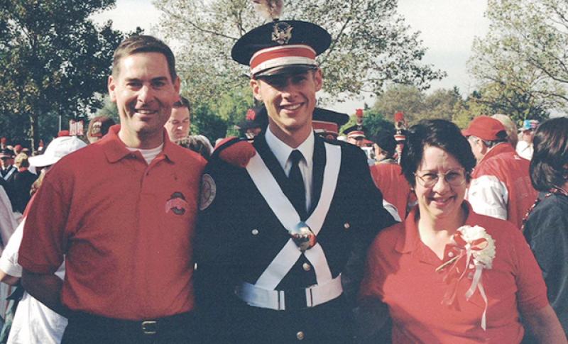 Rob Gast stands with his parents, Bob and Lynn Gast, in 1999.