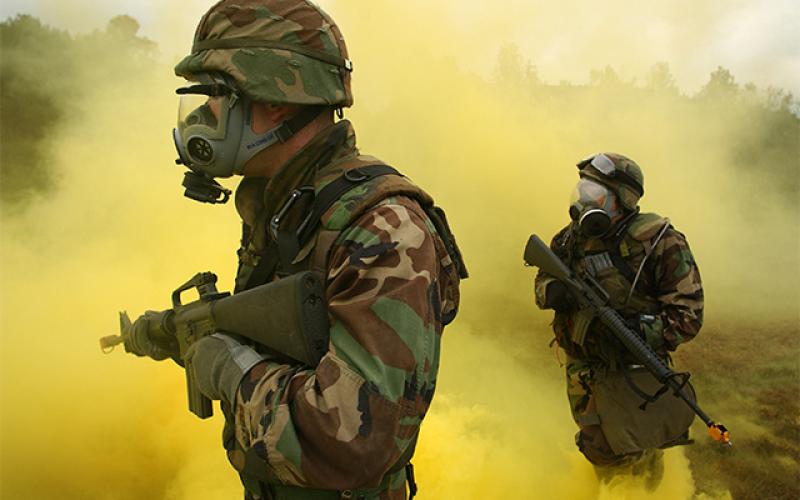 Soldiers training in yellow smoke