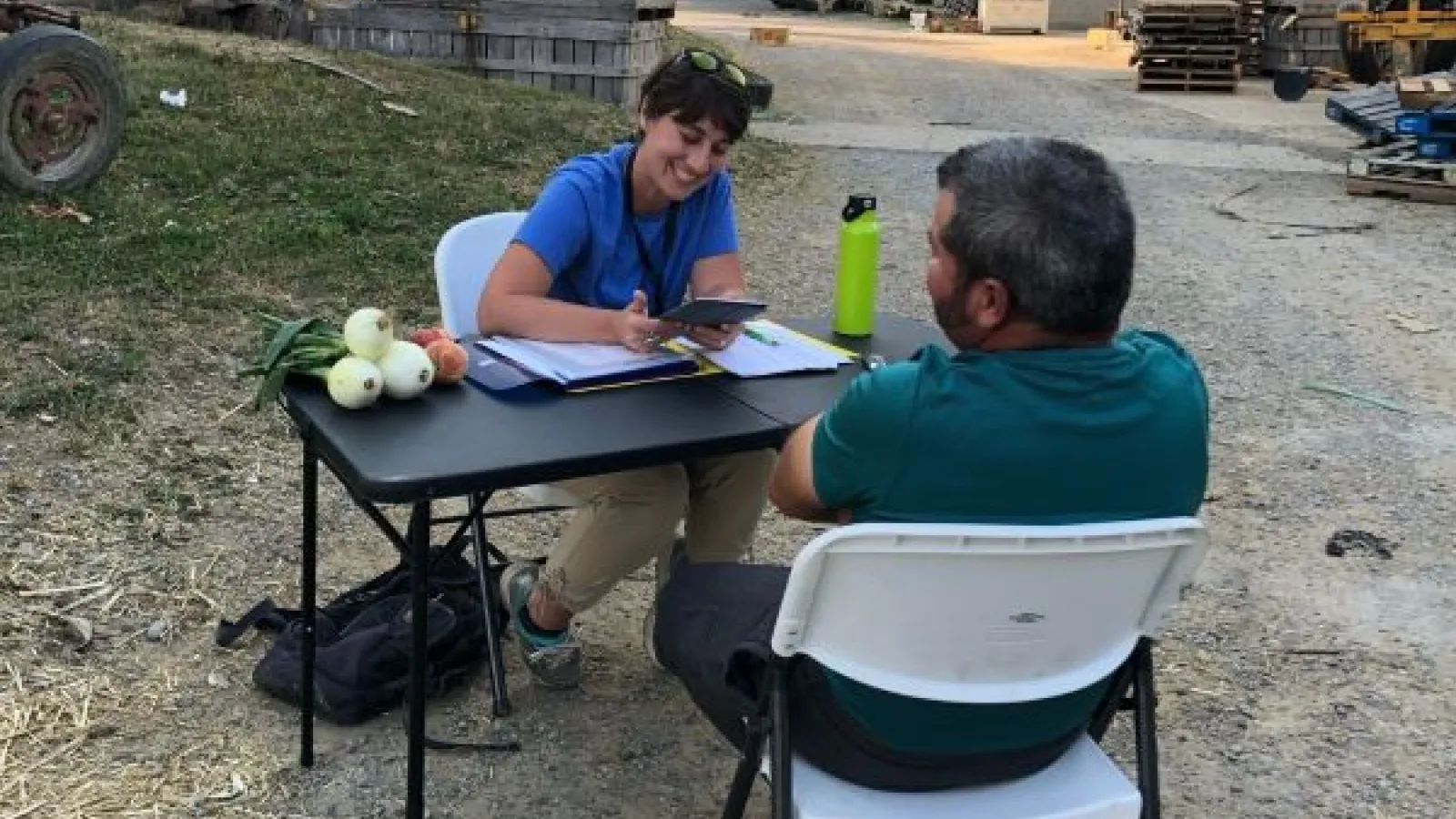 Anisa Kline interviews a farm worker