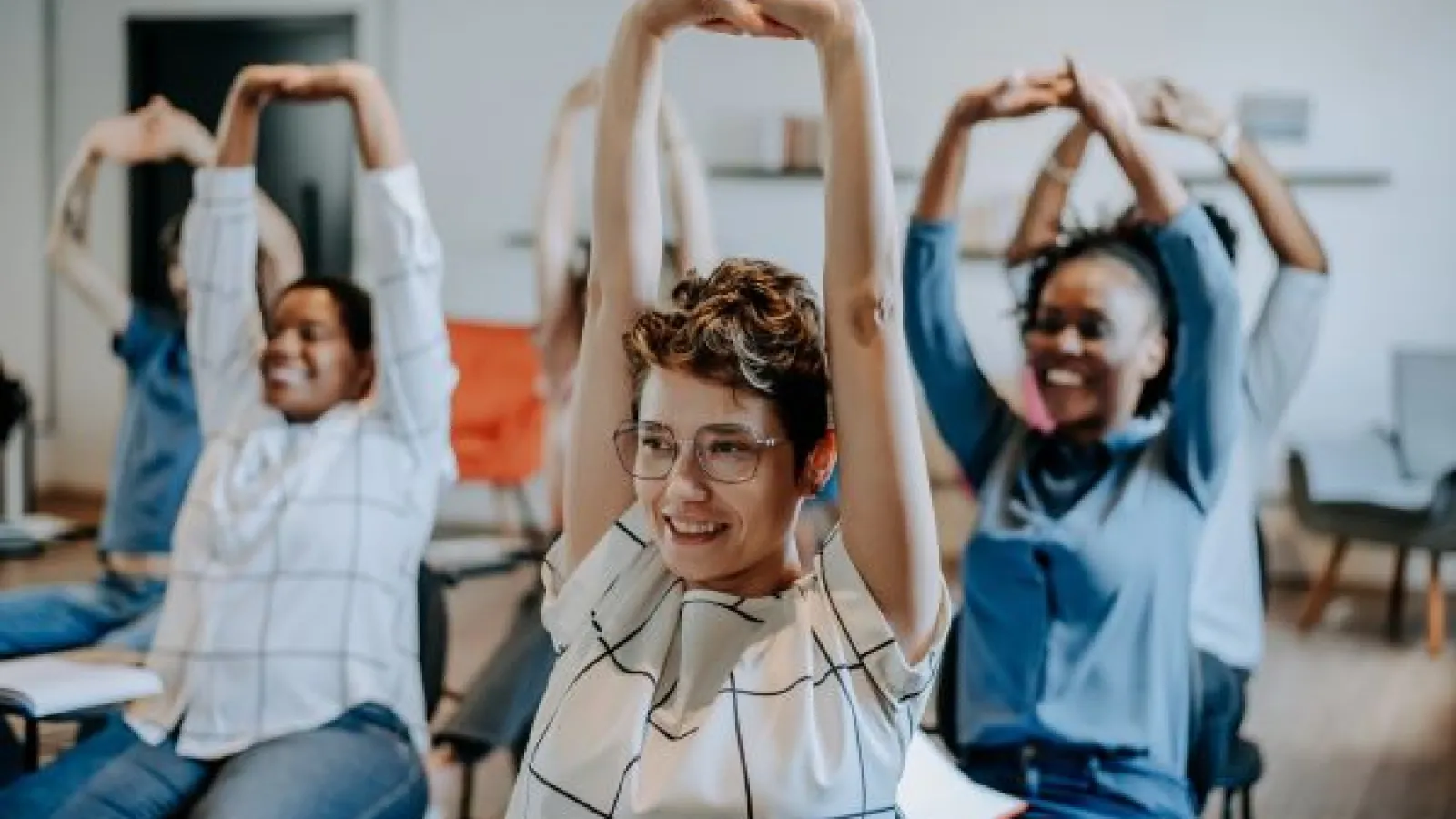 students stretch during class