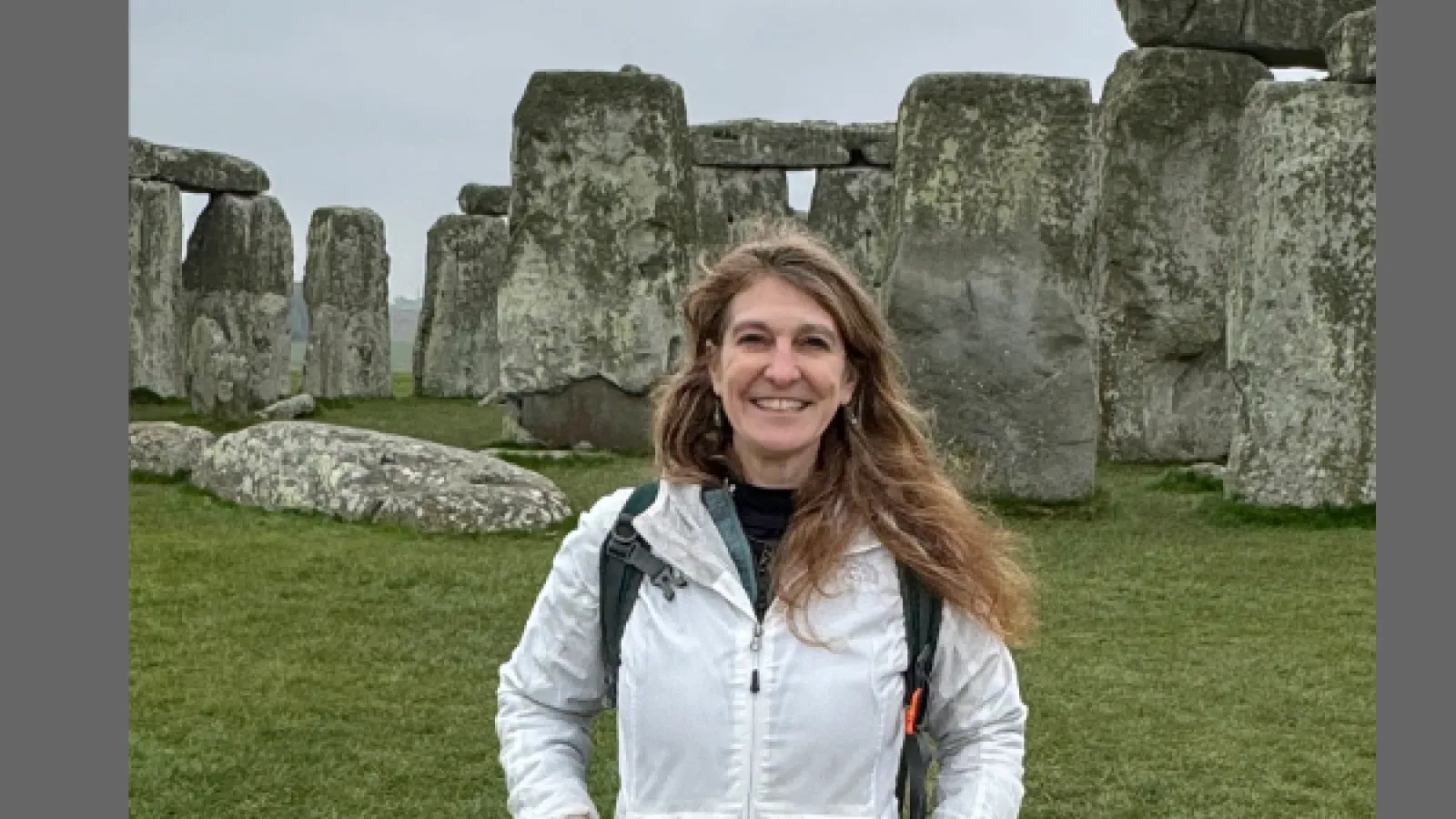 Amanda Bird standing in front of Stonehenge