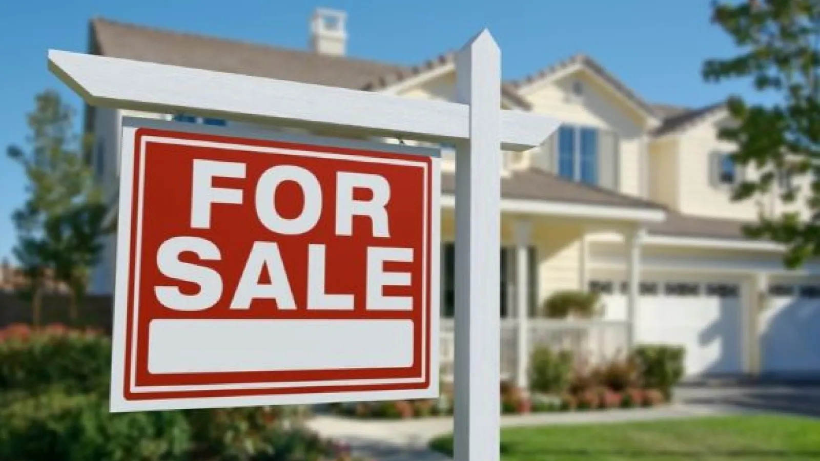 for sale sign in front of a home