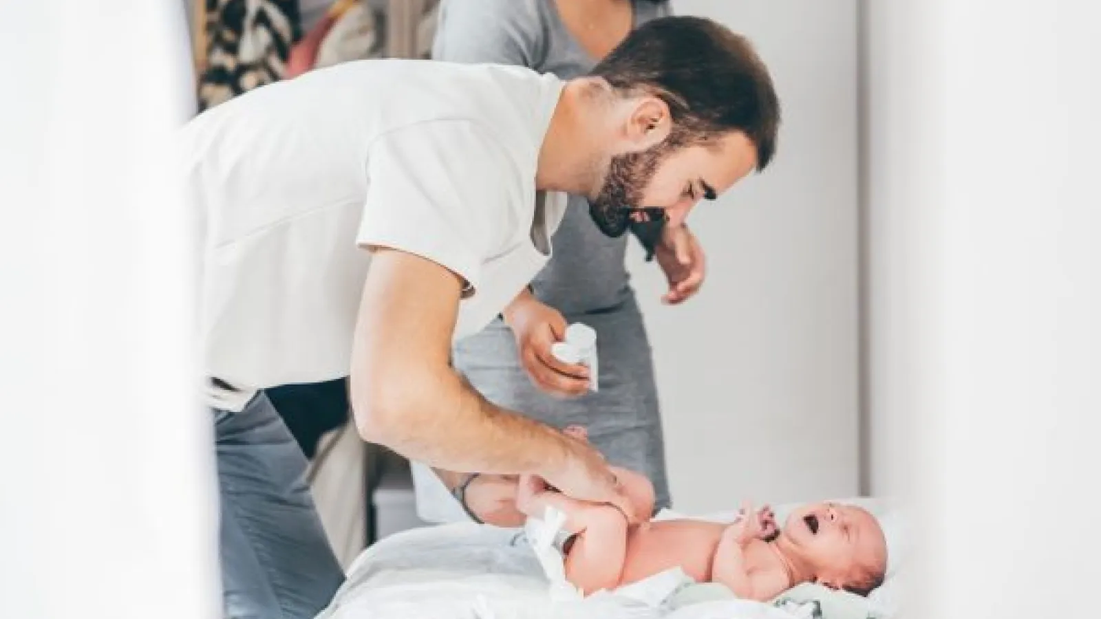 a dad taking care of a baby