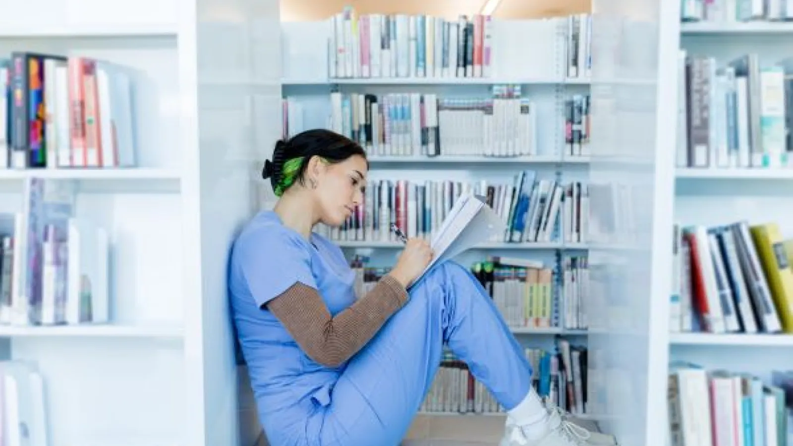 a medical student studying in a library