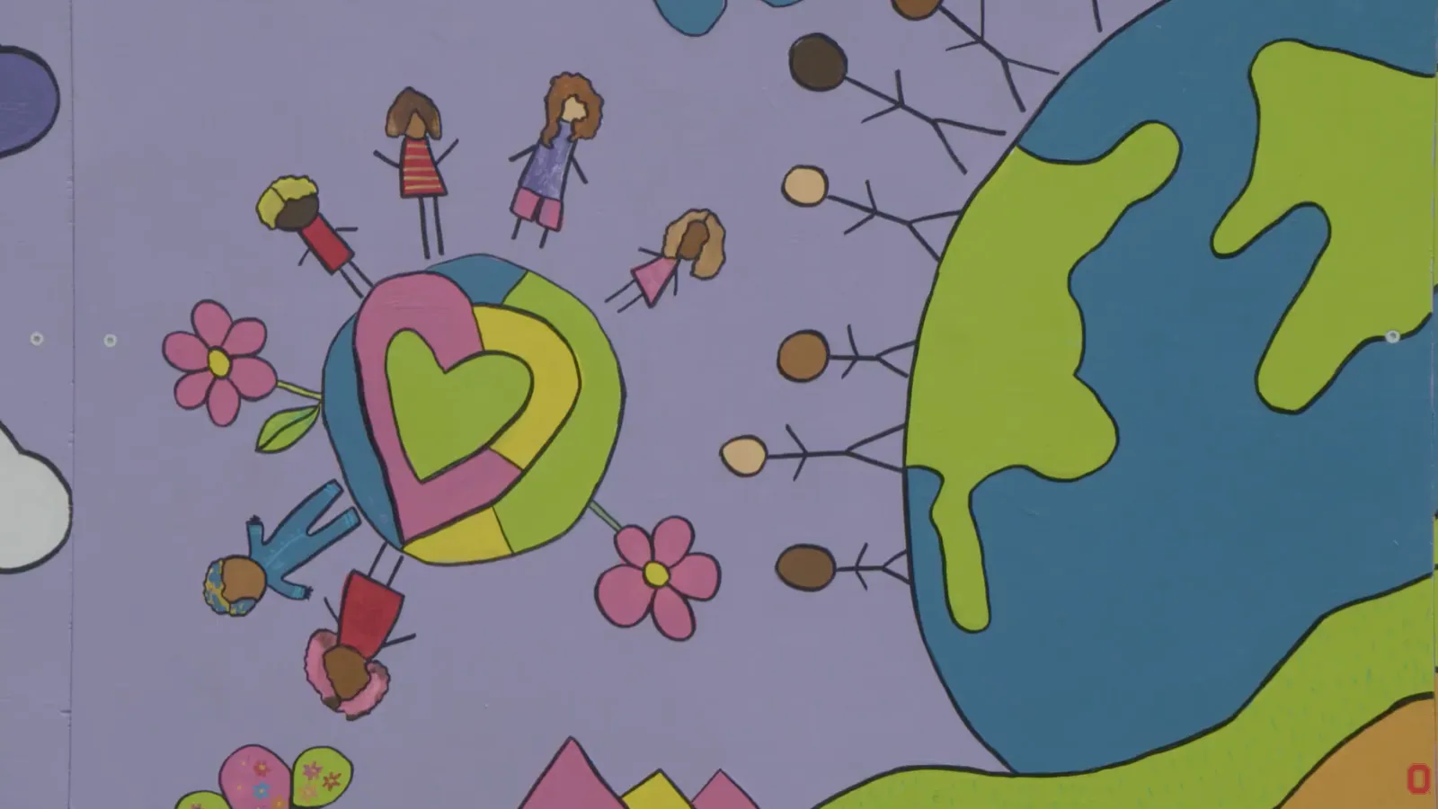 a brightly colored mural showing children sharing space on Earth