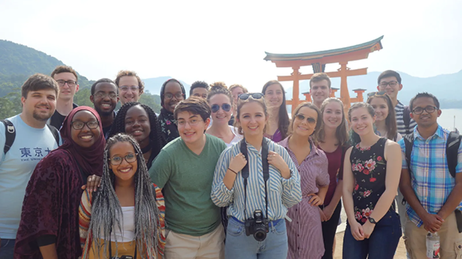 A group of students stand in front of a torii during their study abroad course in Japan in May 2018