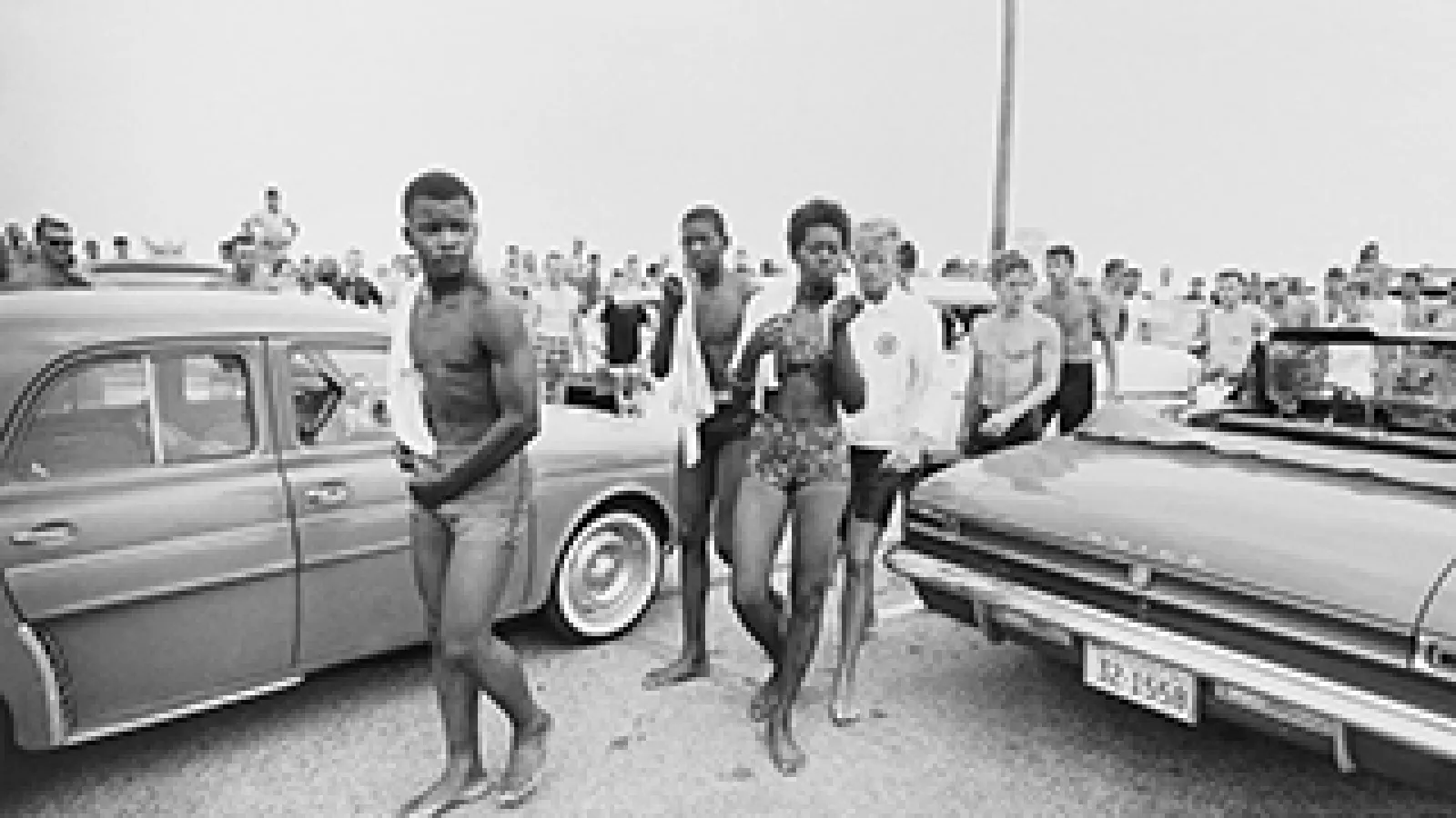 A jeering crowd follows three Black youths in 1963 (Getty Images)
