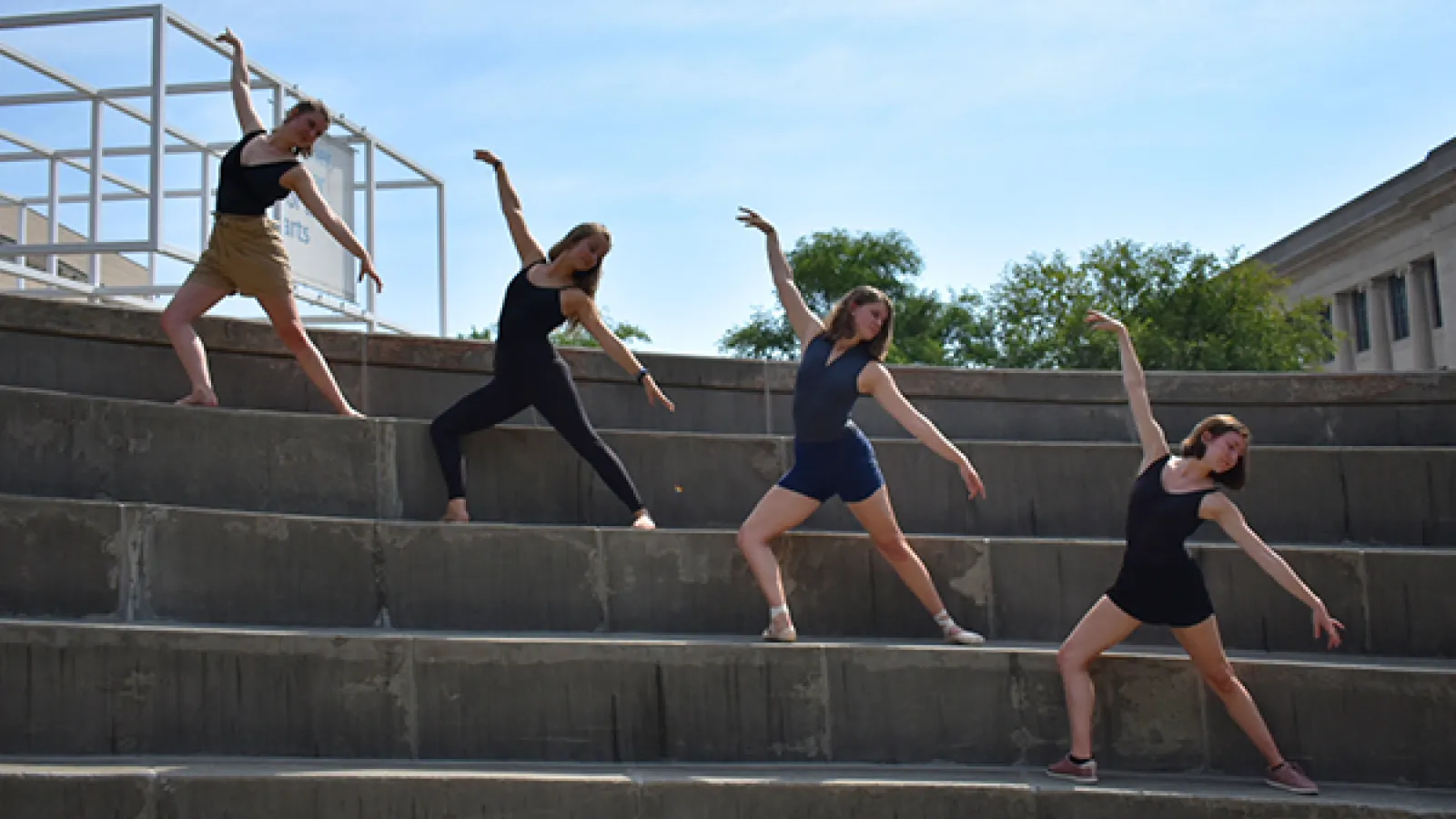 Ballet dancers posing on steps