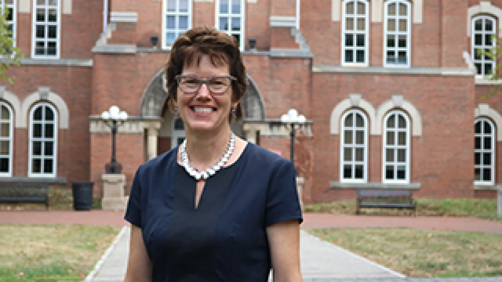 Dean Gretchen Ritter in front of University Hall