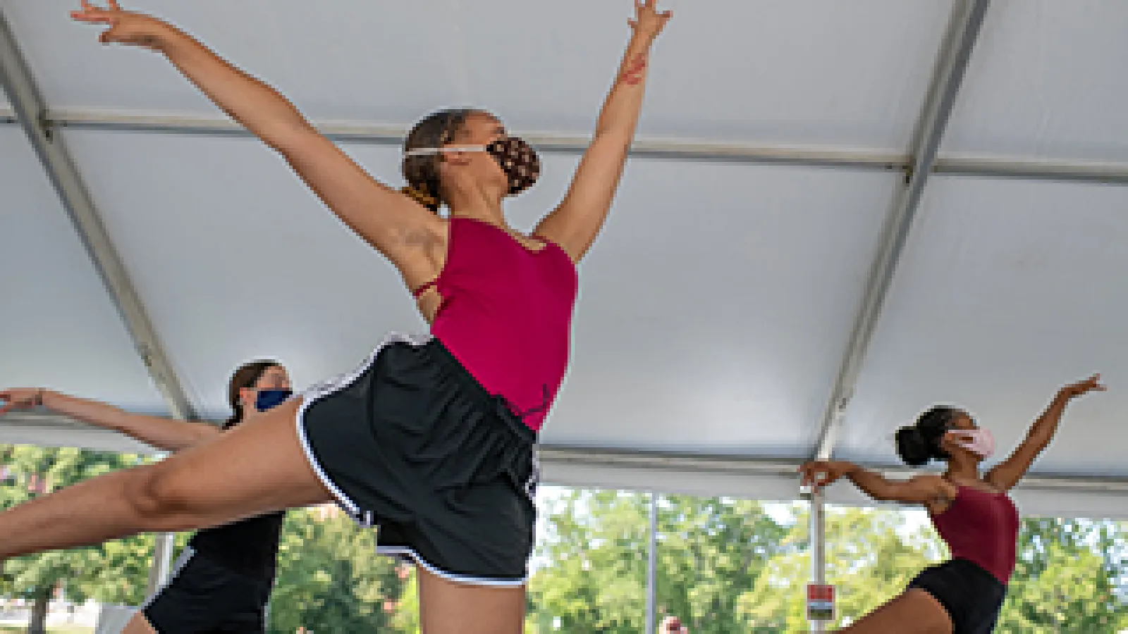 Students dance during ballet class in a tent on the South Oval. Photo credit Jo McCulty.