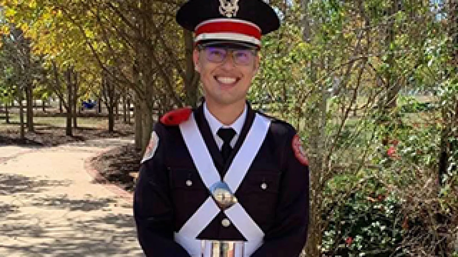 Christopher Lewis in marching band uniform
