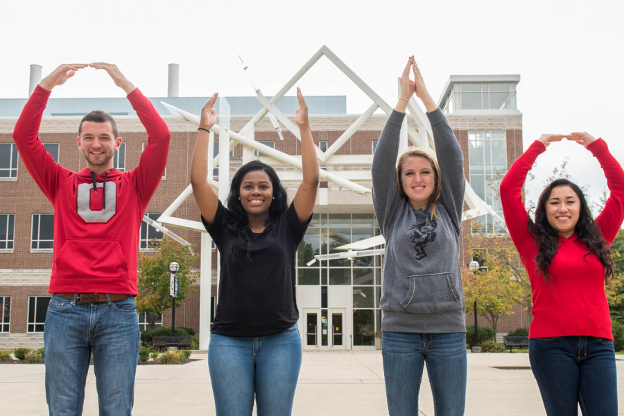 Students spelling out O-H-I-O with arms