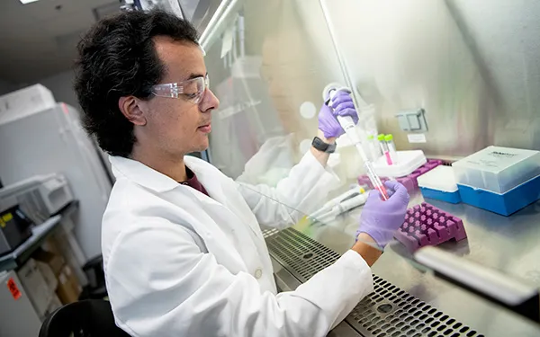 A male scientist working in a lab