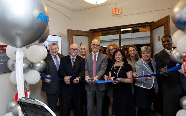 People cutting the ribbon at the Amgen STEM Learning Center opening