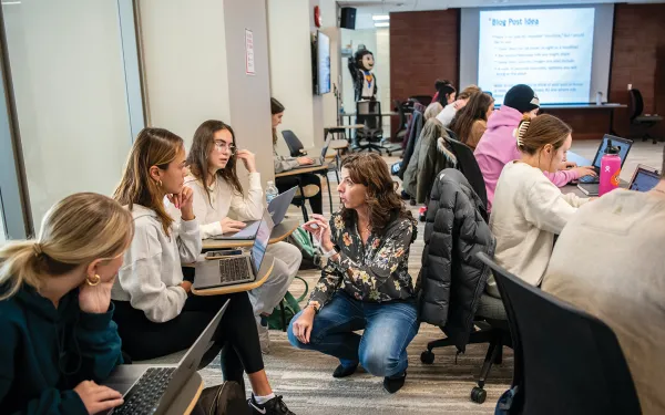 Faculty member teaching students in a classroom