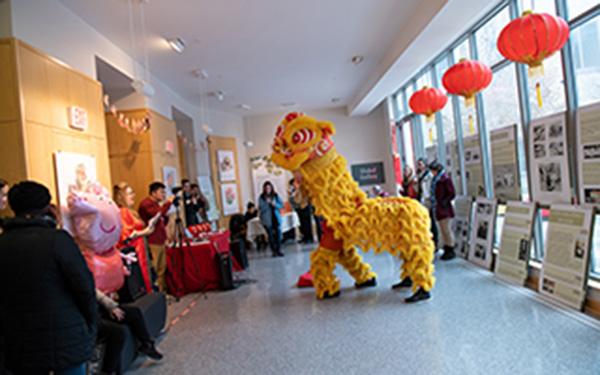 A traditional Chinese dragon dance in a hallway