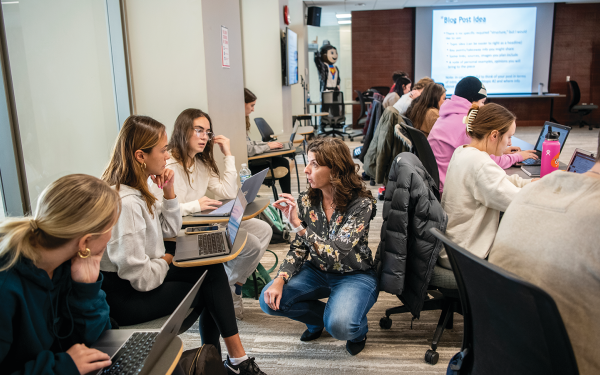 Faculty member teaching students in a classroom