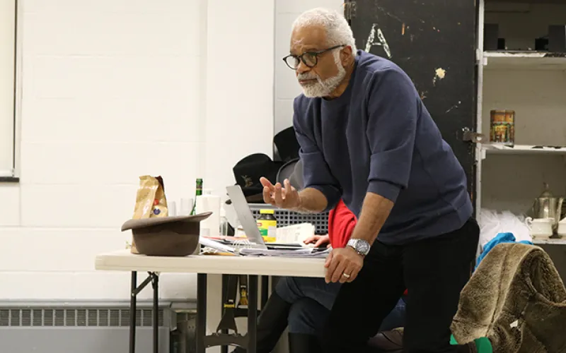Ted Lange gives instructions to his cast during rehearsal.