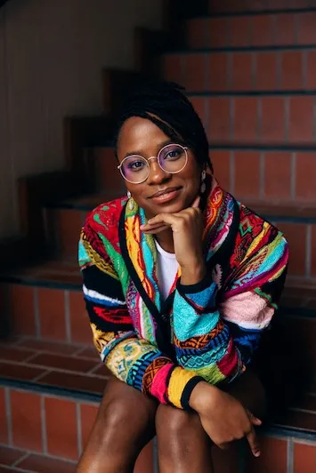 Photo of Dorian Locklyn sitting on stairs