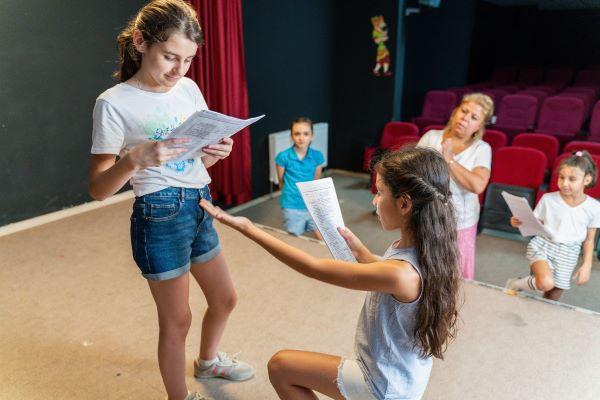 Children in a theater rehearsal