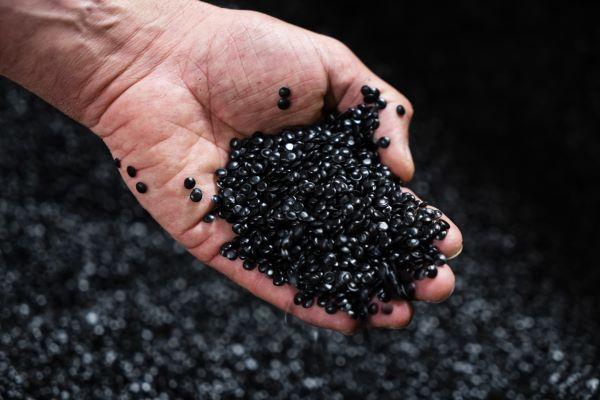 a handful of black plastic pellets